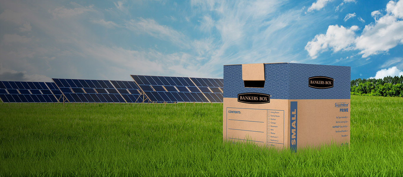 image of a moving box on the ground with green grass and trees around it