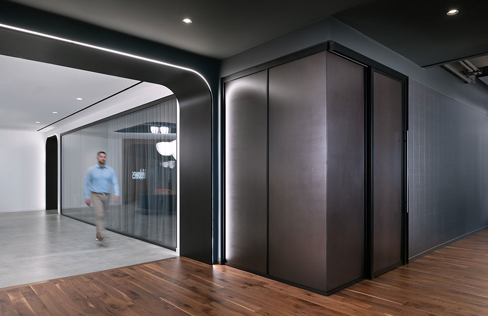 Man walking in office hallway