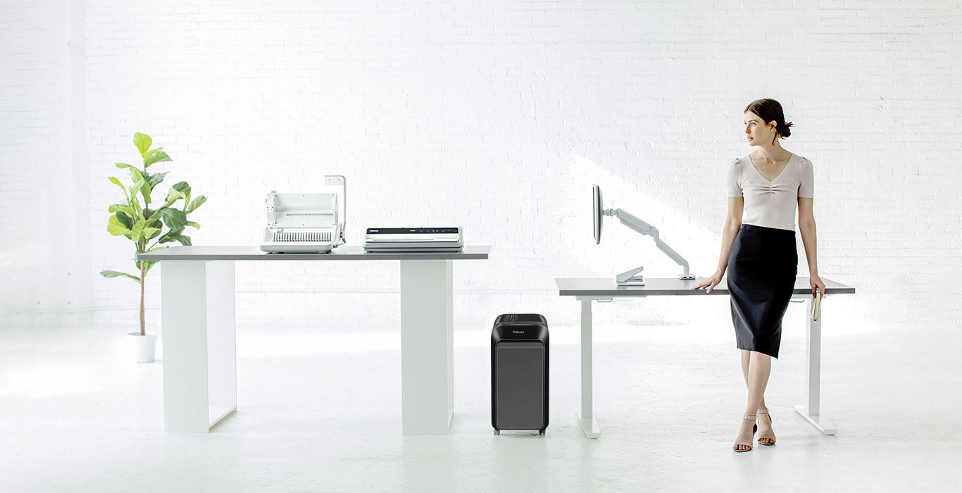 Business Woman Resting againts a Desk