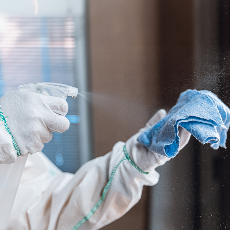 Spraying a cleaning cloth