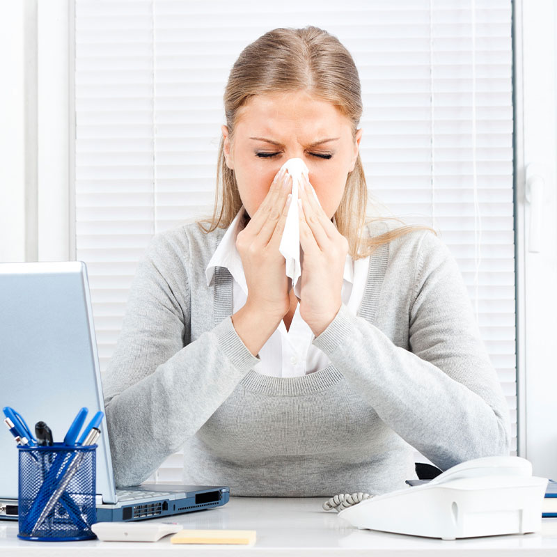 Woman sneezing