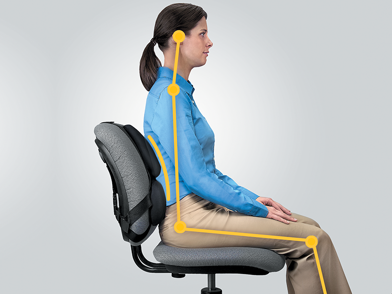 Man sat upright in a chair using a back support