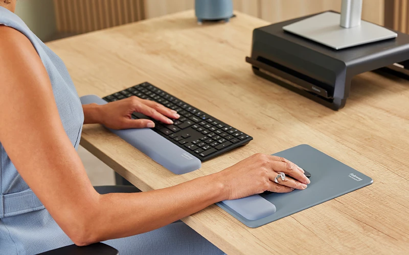 Image of a hand on a mouse mat