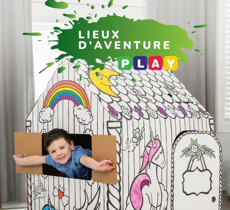 Boy playing in playhouse  