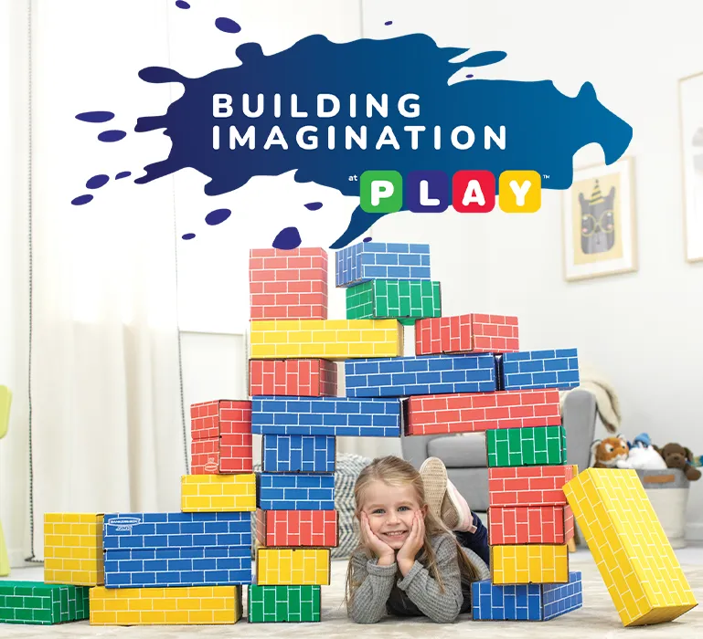 Girl playing in building blocks