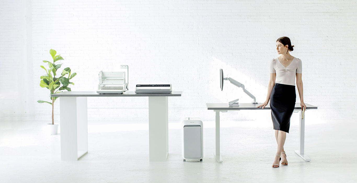 Business Woman Resting againts a Desk