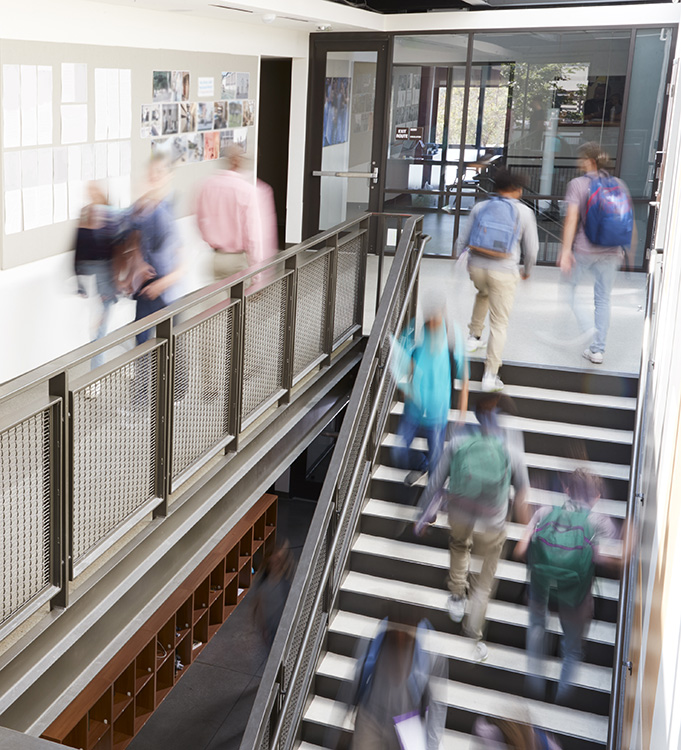 students walking up and down a stair-well