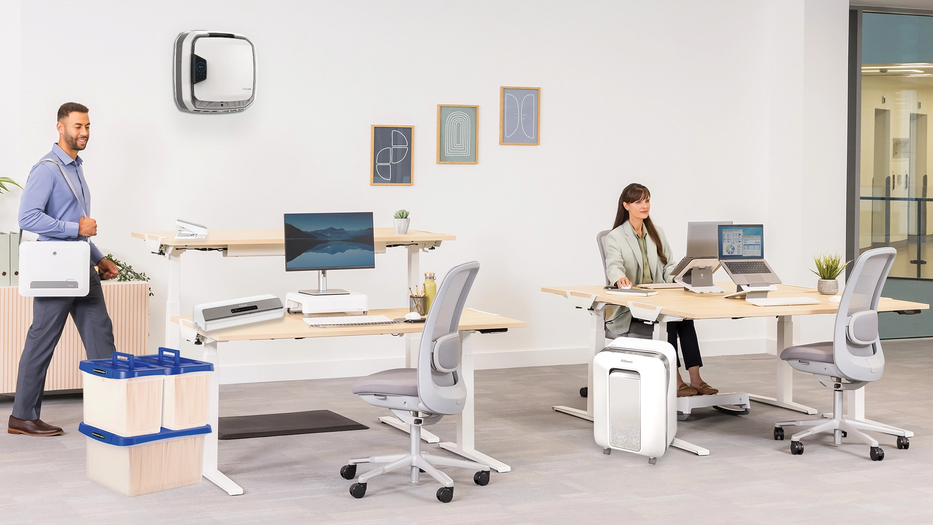 The WorkLife Coach leaning on a desk of Fellowes products