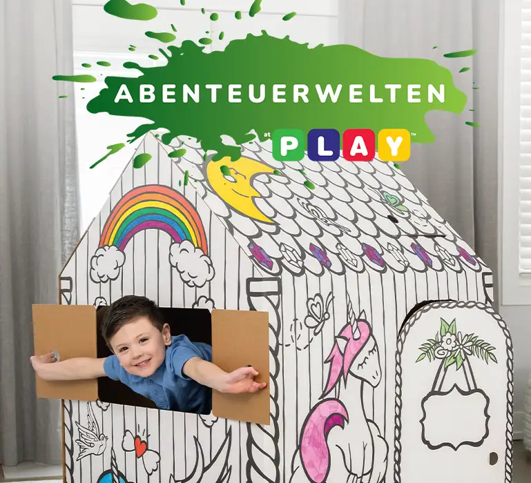 Boy playing in playhouse