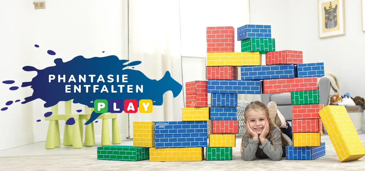 Girl playing in building blocks