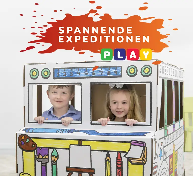 Boy playing in playhouse  