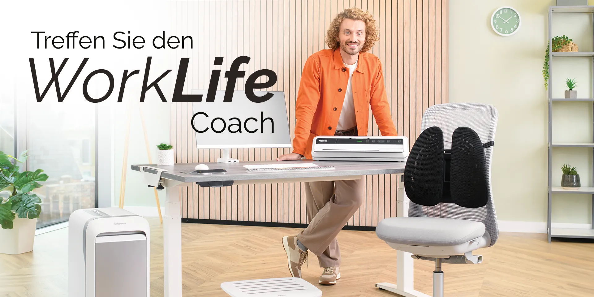 The WorkLife Coach leaning on a desk of Fellowes products