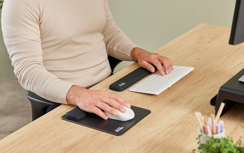 Image of a hand on a mouse mat