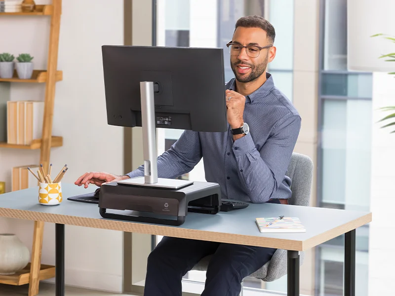 Man adjusting a monitor