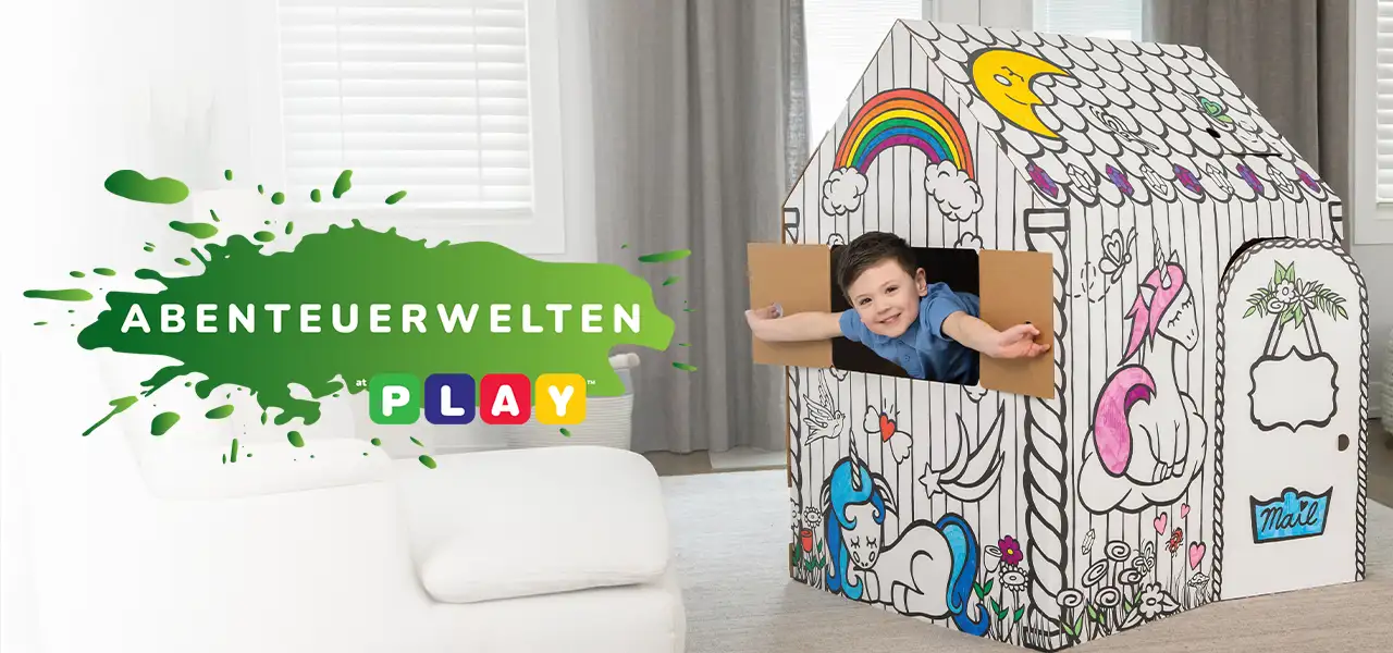 Boy playing in playhouse