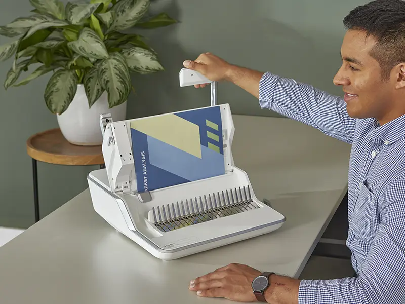 Man using a binding machine