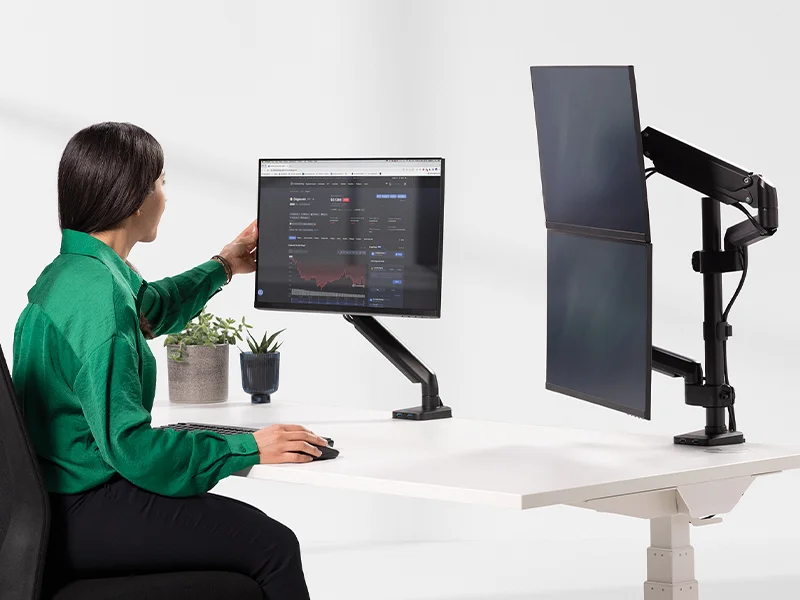Lady adjusting monitor arm on desk
