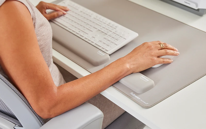 Image of a hand on a mouse mat