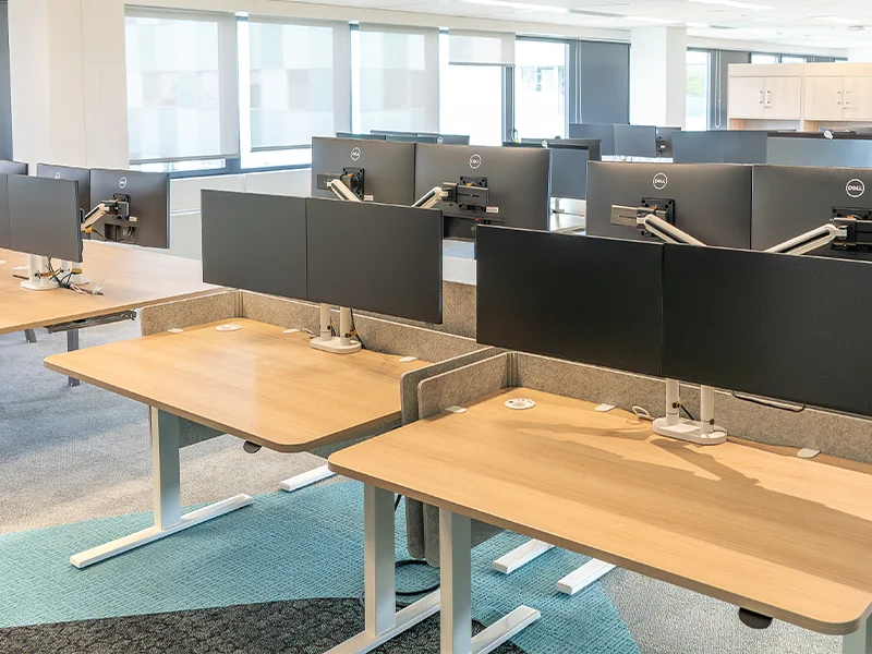Monitor arms on desks