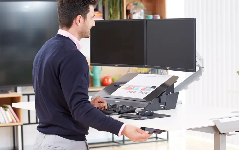 Man stood at a height adjustable desk