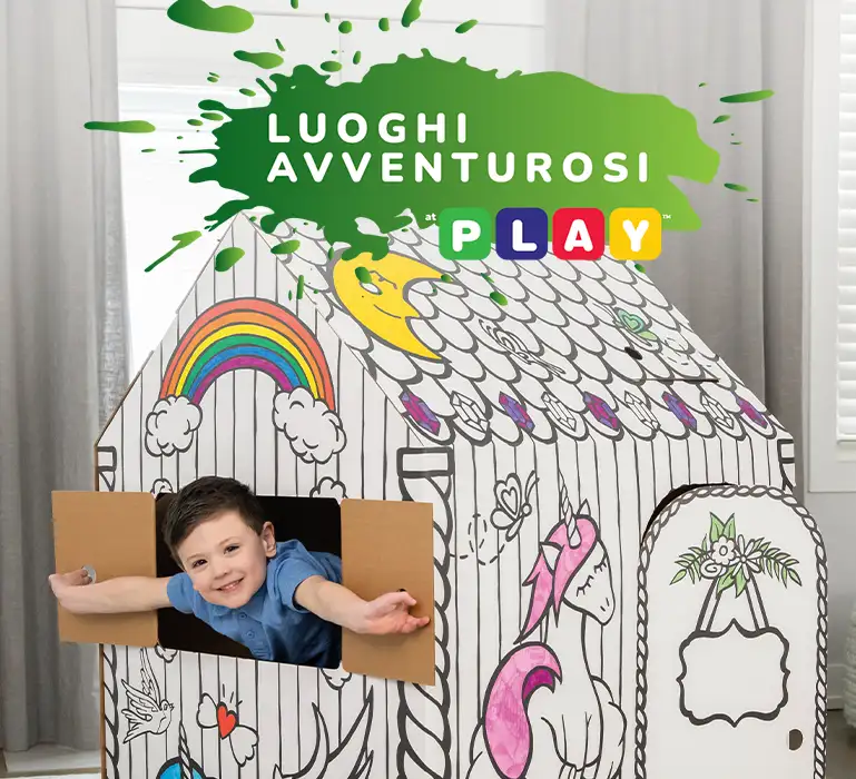 Boy playing in playhouse  