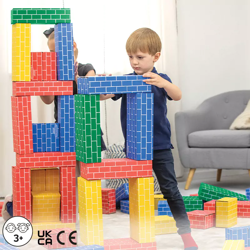 Boy playing with building blocks