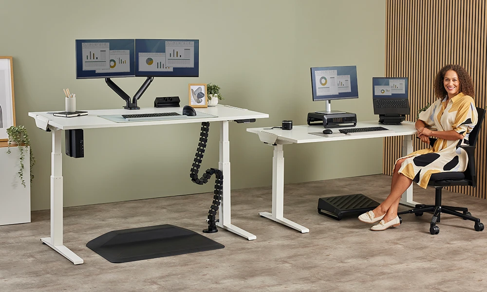 Man sat at sit-stand desk set up