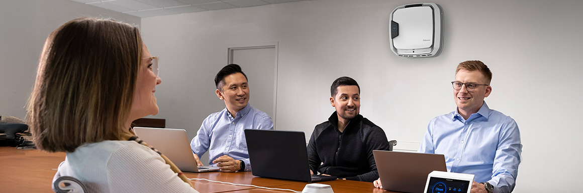 Image of a group of 4 people in a conference room