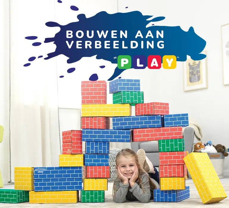 Girl playing in building blocks