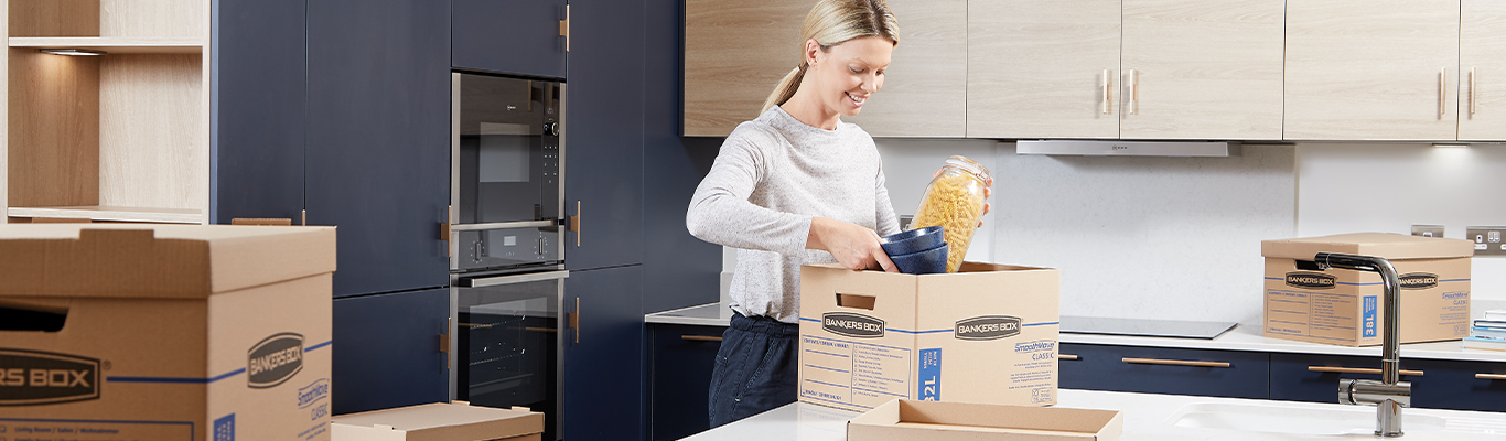 Woman sitting at desk with a magazine file