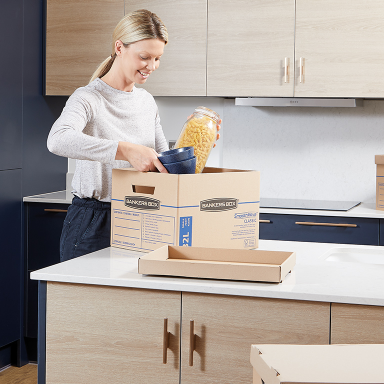 Woman sitting at desk with a magazine file