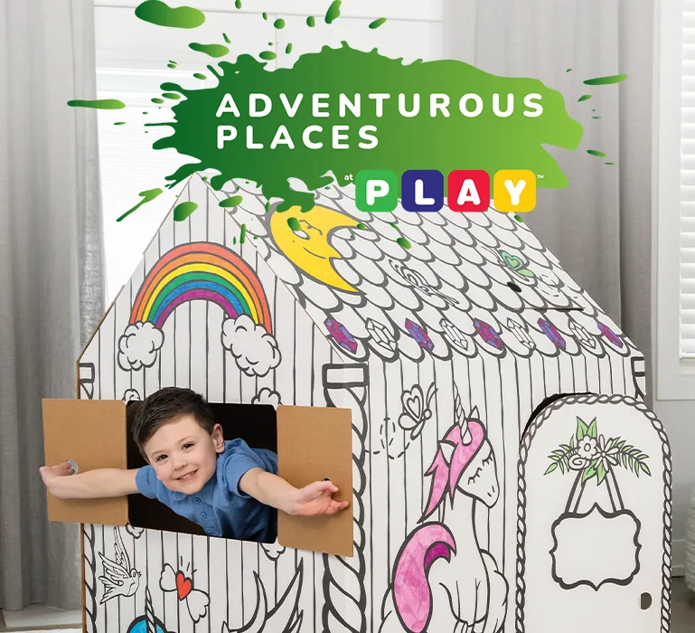 Boy playing in playhouse  