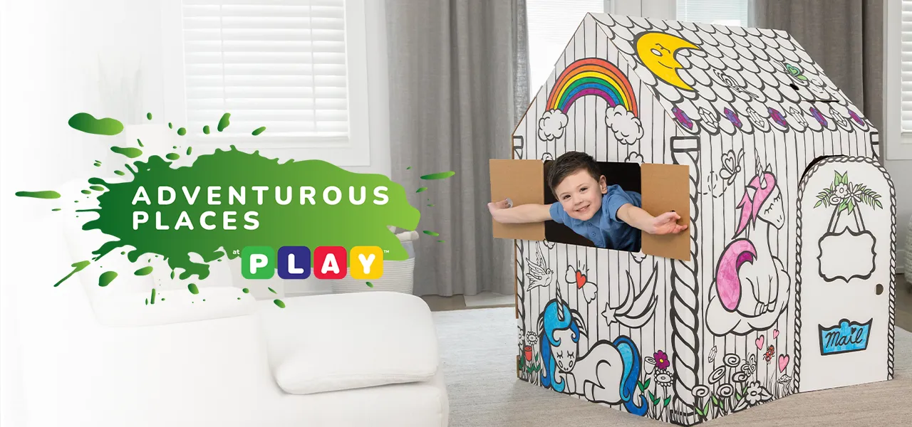 Boy playing in playhouse