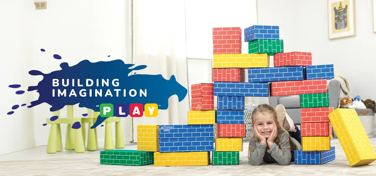 Girl playing in building blocks