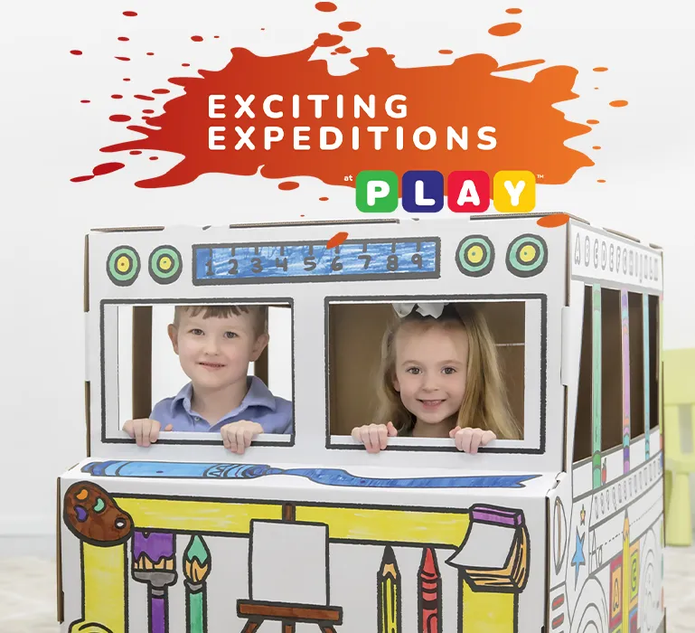 Boy playing in playhouse  