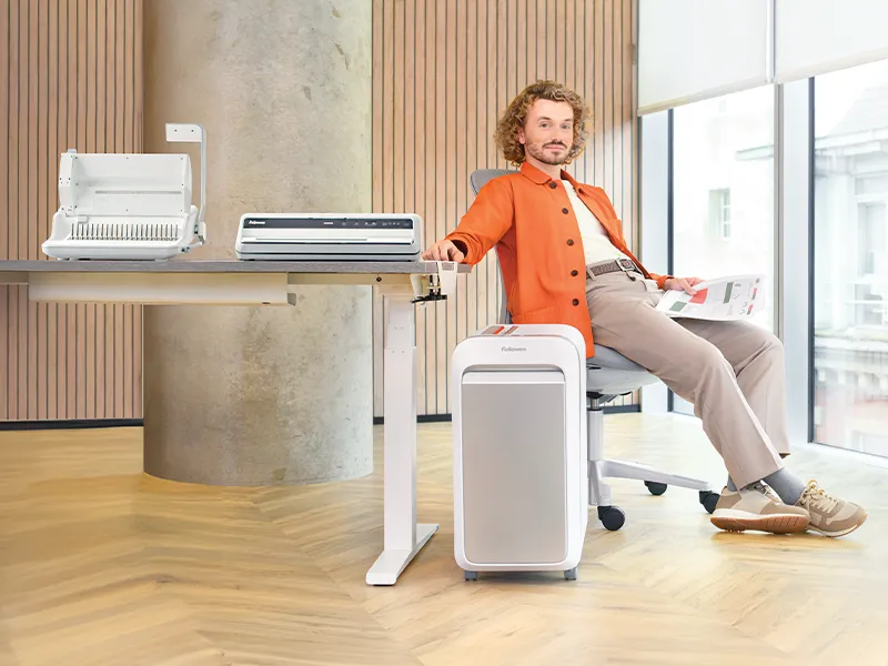 worklife coach sat beside Fellowes products