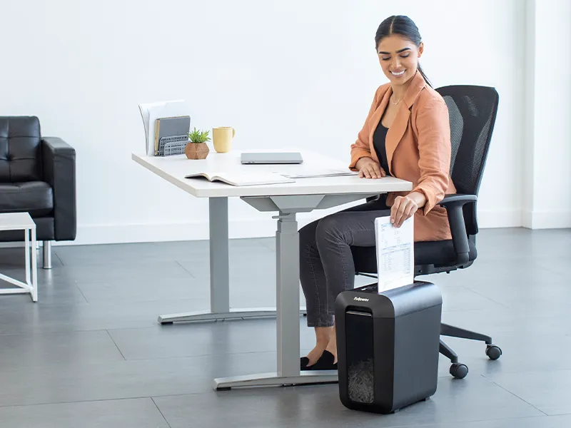 Woman using a shredder