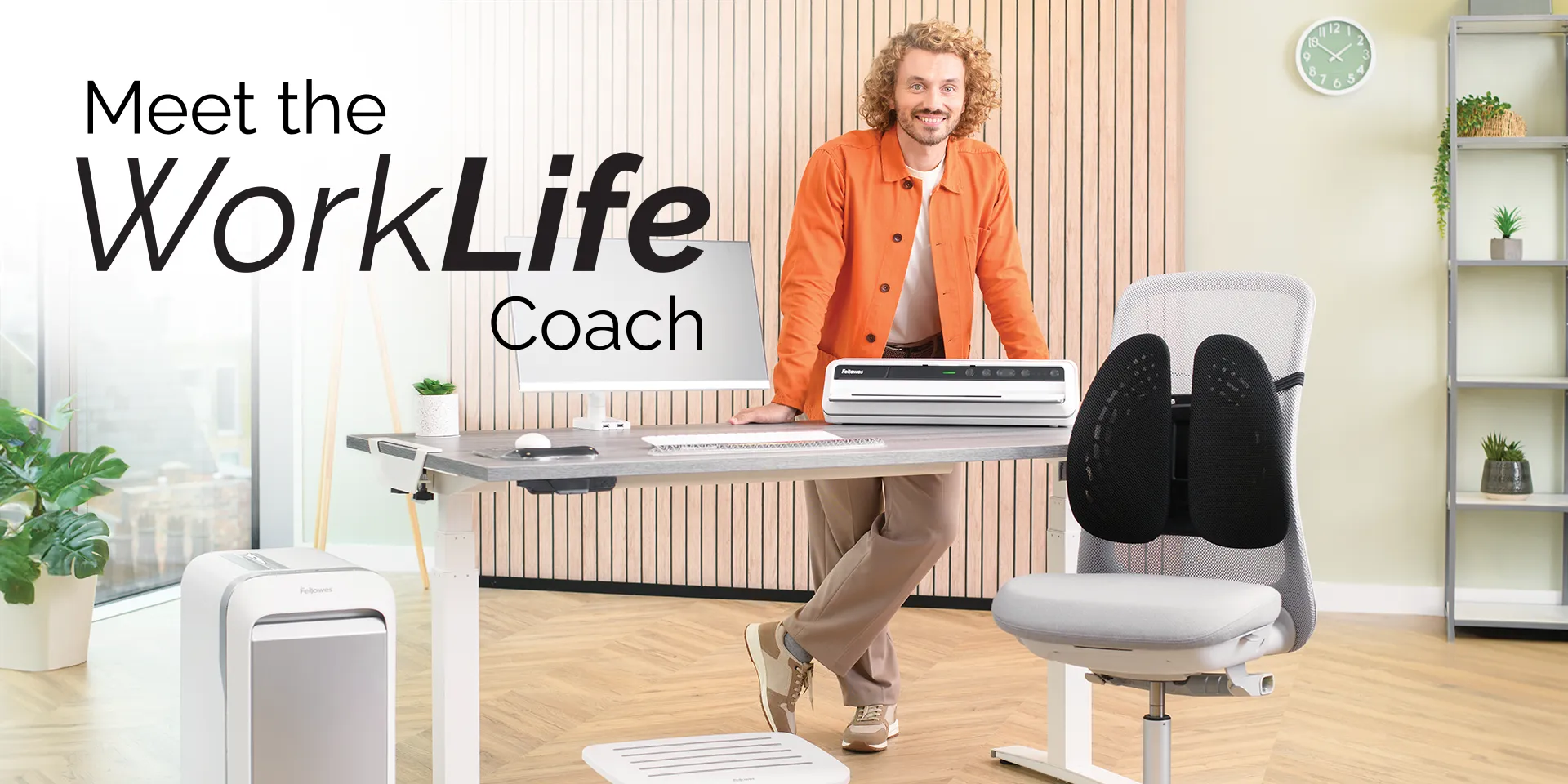 The WorkLife Coach leaning on a desk of Fellowes products