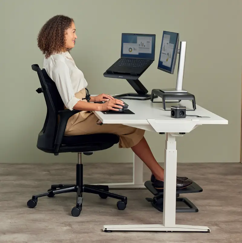 Lady sat ergonomically at a desk