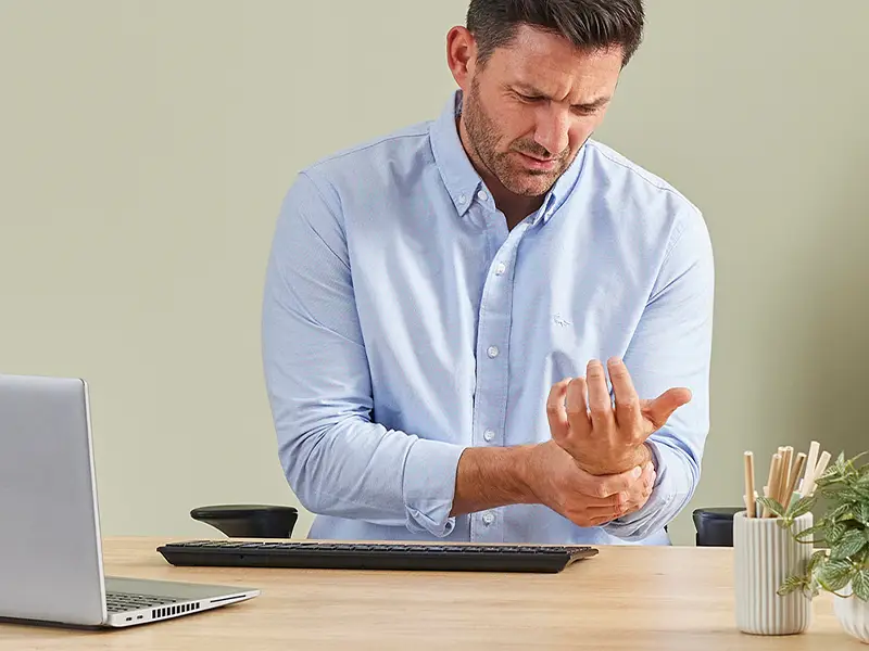 Man holding wrist