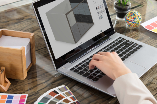 Image of someone using their laptop to look up Fellowes Modular Wall Configurator Tool