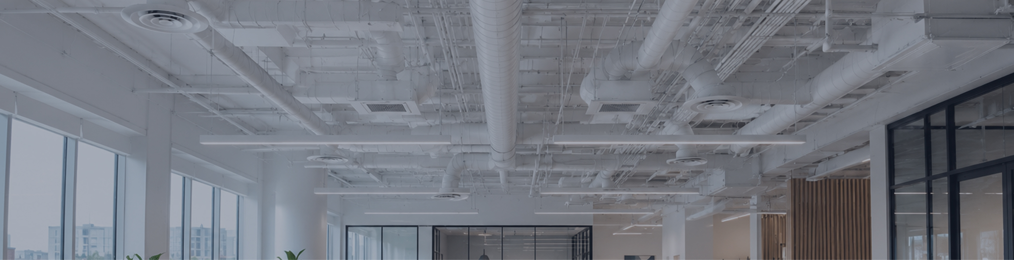 Image of exposed air conditioning ventilation in the ceiling of a building