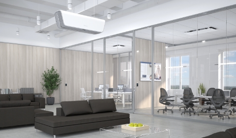 Photo of an empty office space with glass meeting rooms and the Array Ceiling in view