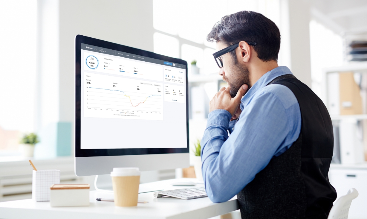 Image of a man looking at the Array Viewport Dashboard on his computer monitor