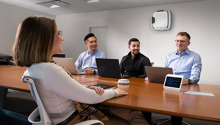 Image of a group of 4 people in a conference room