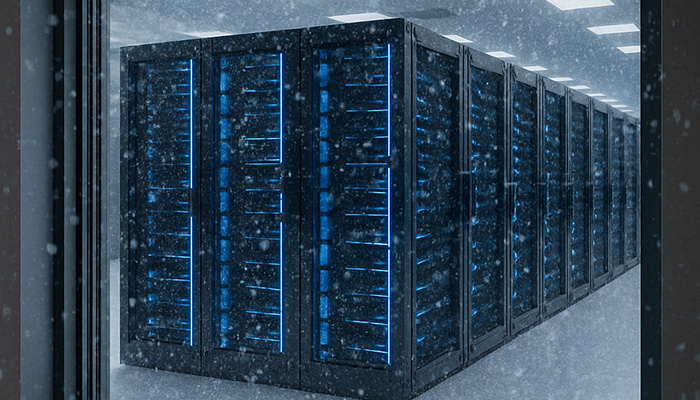 Image of a server room from the outside through a window while it is snowing outside