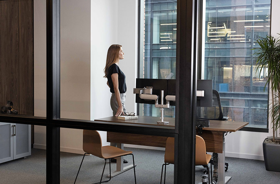 Image of a woman standing in an office