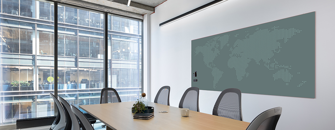 Image of a Markerboard with a custom background hanging on a wall in an office