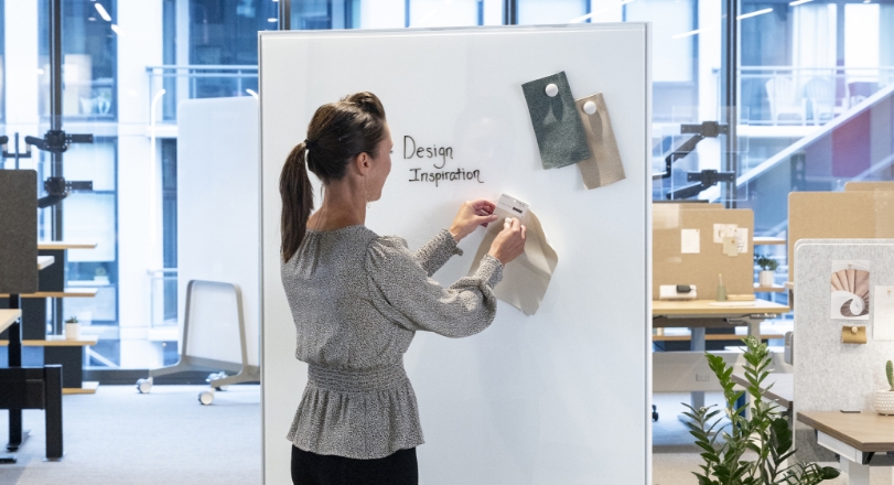 A woman using the eM Markerboard for design inspiration ideas