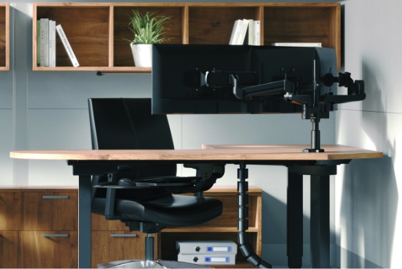 Image of a dual monitor arm attached to a desk